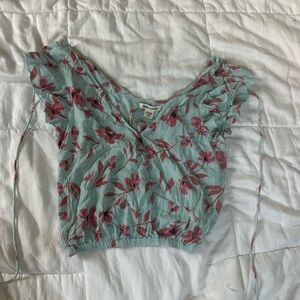 blue billabong top with pink flowers size medium